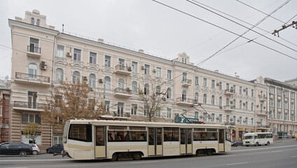 Fototapeta na wymiar Pedestrians and cars are moving along Budenovskiy Avenue,named after the Hero of the Soviet Union, Marshal S.M. Budyonny
