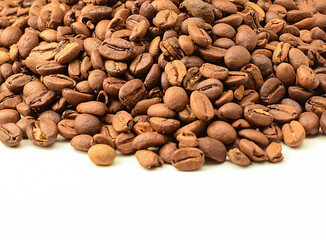 Fragrant roasted coffee beans isolated on white background. Copy space text. Selective focus.