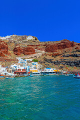 Greece Santorini island in Cyclades, Ammoudi village with fishing boats - 429379082