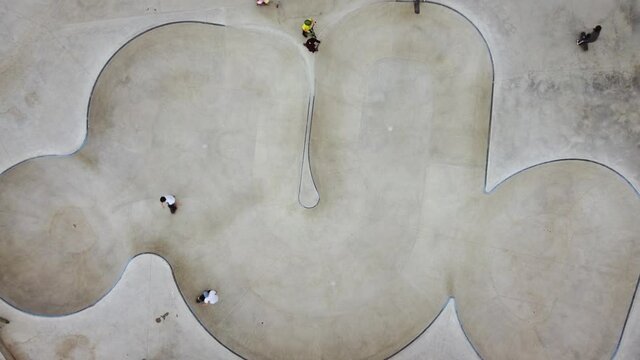 Teenagers Skating At Skate Park