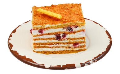 homemade sweet dessert cream cake with lingonberries decorated with white chocolate isolated on white background