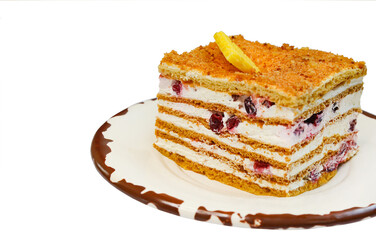 homemade sweet dessert cream cake with lingonberries decorated with white chocolate isolated on white background