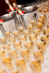 Champagne in bottles and in many glasses