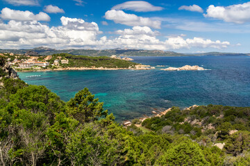 Fototapeta premium Sardinia: Colourful Granite Coastline with Batteria Battistoni Ruins, Islands of Maddellena and Caprera With Blue Sky �?? Baia Sardinia, Smerelda, Sardinia, Italy.