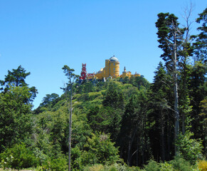 View of the Pena Palace from the Pena Park in Sintra on a sunny day