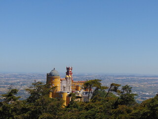 view of the Pena Palace, Sintra, portugal,  from the top of the hill, on sunny  may day