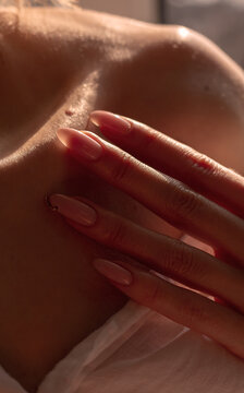 Female hand and clavicle close up