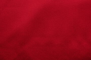 Red fabric texture background close up