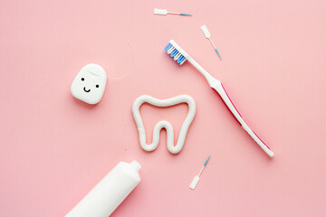 Toothbrush with tube of toothpaste and dental floss. Oral care and dental hygiene
