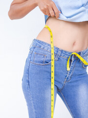 woman measuring their waist