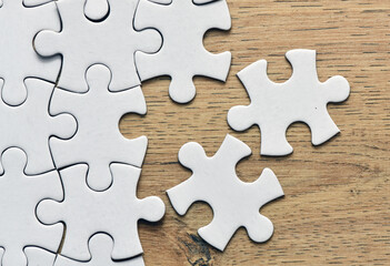 Obraz premium Assembling jigsaw puzzle pieces. Abstract background.