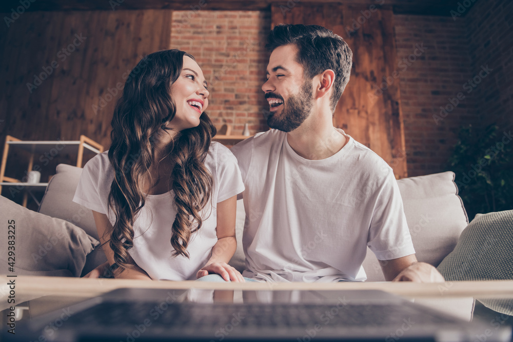 Wall mural Portrait of beautiful handsome cheerful friends friendship making video call having fun at loft style interior home house indoor