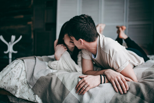 girl with a guy in the studio hugging, home cozy pictures