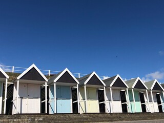 Fototapeta na wymiar Traditional beach huts at a British seaside resort