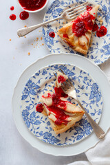 Close up shot of apple tart with raspberries jam. Flat lay styling