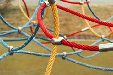 Colorful ropes on the sports ground. Connections of rope ropes for training.
