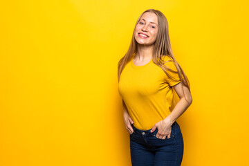 Portrait of a young beautiful woman on yellow background.