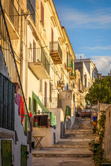 Picturesque facades and balconies in the old town of Vieste, Gargano, Italy