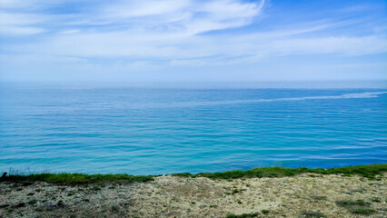 Seascape morning calm sea with spring shore. High quality photo