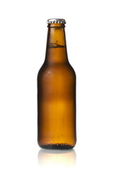 Brown beer bottle in a white background. Beer brown bottle with drops isolated in white background