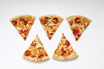 beautifully folded pieces of pizza on a white background