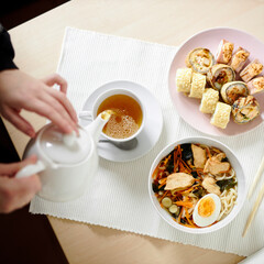 Japanese lunch of ramen, sushi and fresh tea