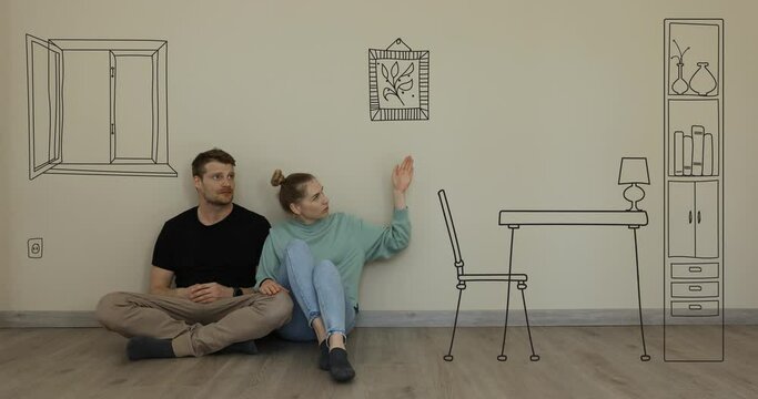 young couple imagine interior of new house. sitting on floor and dreaming in empty room