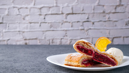 Cherry strudel with ice cream. Copy space