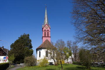 Fototapeta na wymiar Protestant church Zurich Schwamendingen at springtime. Photo taken April 21st, 2021, Zurich, Switzerland.