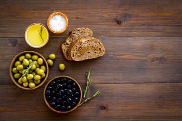 Sliced bread ciabatta with olives and oil. Greek or Italian meal