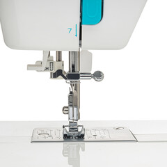 Sewing machine for sewing clothes from fabric on a white isolated background. Front view