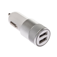Car charger for mobile phone or smartphone. Connector for a cable for a USB port. Plugs into the car's cigarette lighter. White and silver