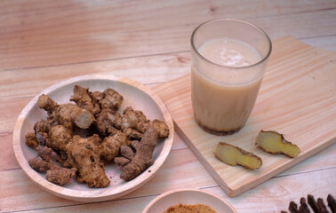 Ginger drink in glass, Close up ginger detail in bowl