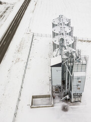Aerial View of Modern Granary, Grain-drying Complex in snowy winter day, Latvia.
