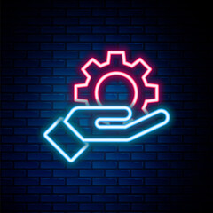 Glowing neon line Hand settings gear icon isolated on brick wall background. Adjusting, service, maintenance, repair, fixing. Colorful outline concept. Vector