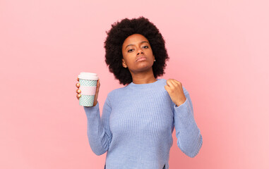 afro woman looking arrogant, successful, positive and proud, pointing to self. coffee concept
