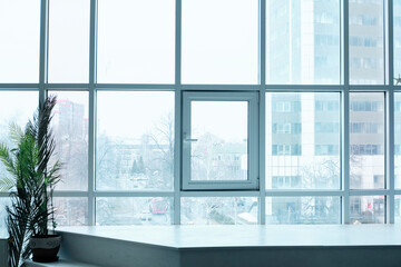 Fototapeta na wymiar Office interior. Panoramic window with city view