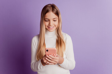 Photo of excited girl use cellphone enjoy texting