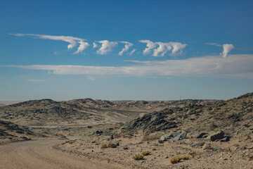 clouds in the form of the number seven on Cape Dias near the city of Luderitz Namibia