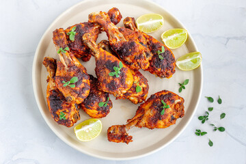 Grilled Chicken Legs Garnished with Fresh Marjoram Top Down, Grilled Meat, Summer Food, Top Down Photo

