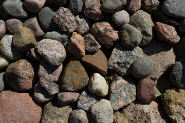 Little granite stones on the ground. Natural background.