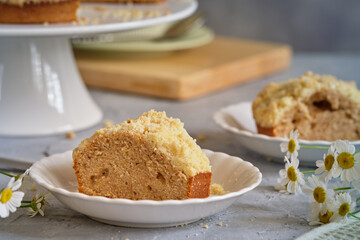 Fragrant cupcake on a white high stand on a gray background