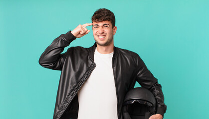 motorbike rider feeling confused and puzzled, showing you are insane, crazy or out of your mind