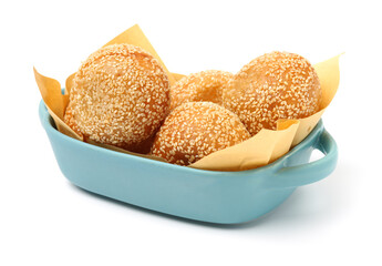 Golden fried dessert balls covered with sesame on white background