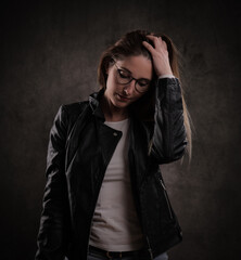 Attractive young woman poses for the camera - studio photography