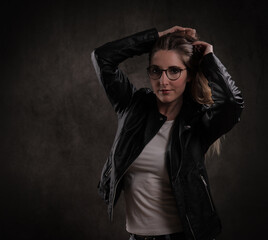 Attractive young woman poses for the camera - studio photography