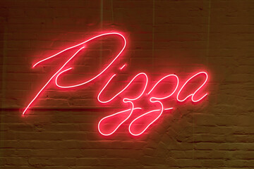Pizza - neon sign on a brick wall at night. Restaurant takeaway pizzeria - Powered by Adobe