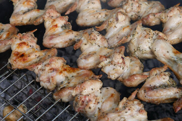 Barbecue with chicken wings. Close. Summer day