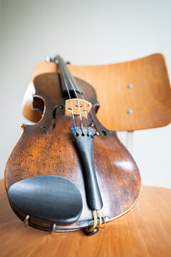 old violin on a chair