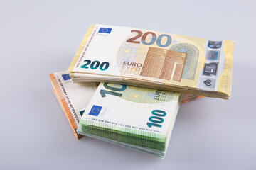 Stack of banknotes on a white background.
